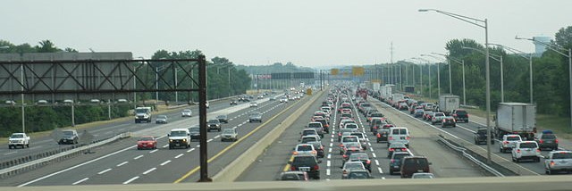 A busy highway with cars in traffic.