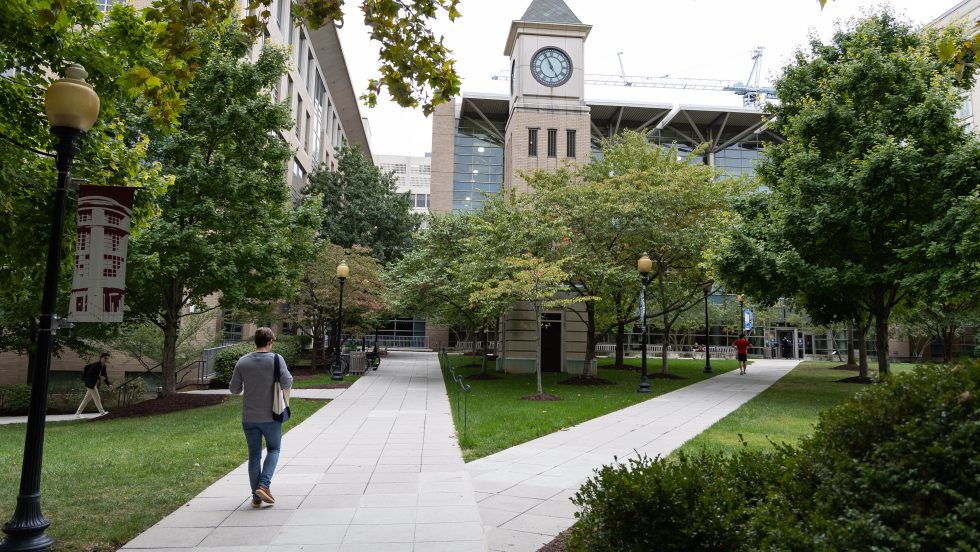 Photo of the Georgetown Law campus and clocktower in springtime