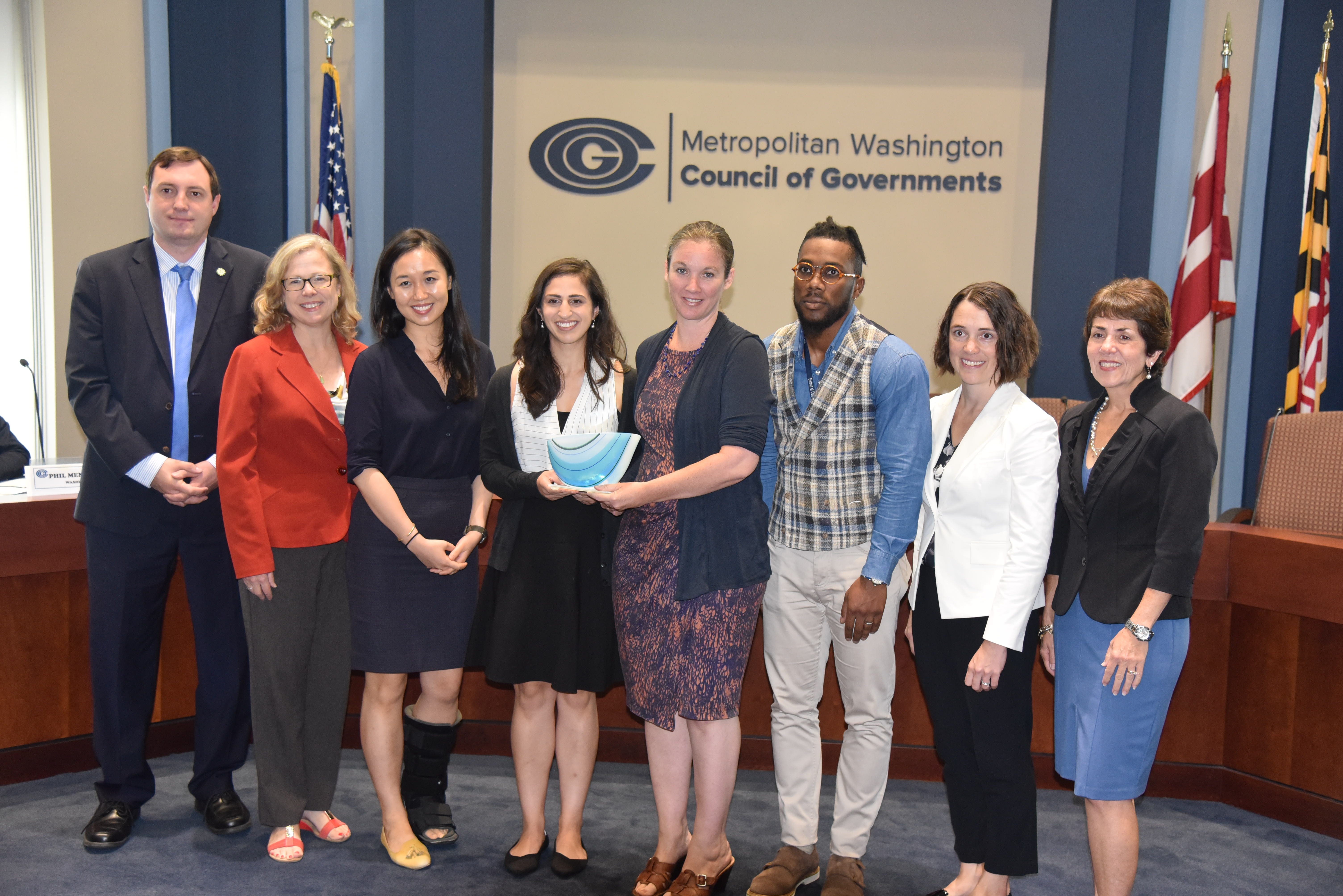 Metropolitan Council of Governments members Matt Letourneau, Gretchen Goldman, and Mary Lehman stand with Georgetown Climate Center staff Vicki Arroyo, Jennifer Li, and Jessica Grannis, and DC Department of Energy and Environment representatives Melissa Deas and Everette Bradford. They display the 2018 Climate and Energy Leadership Award.