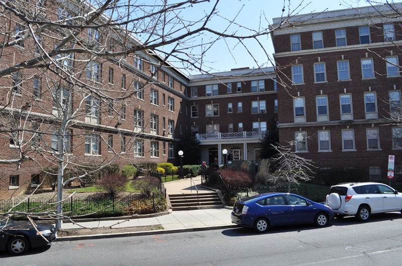 A brown stone apartment building